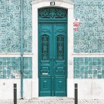 brown wooden door on gray concrete wall